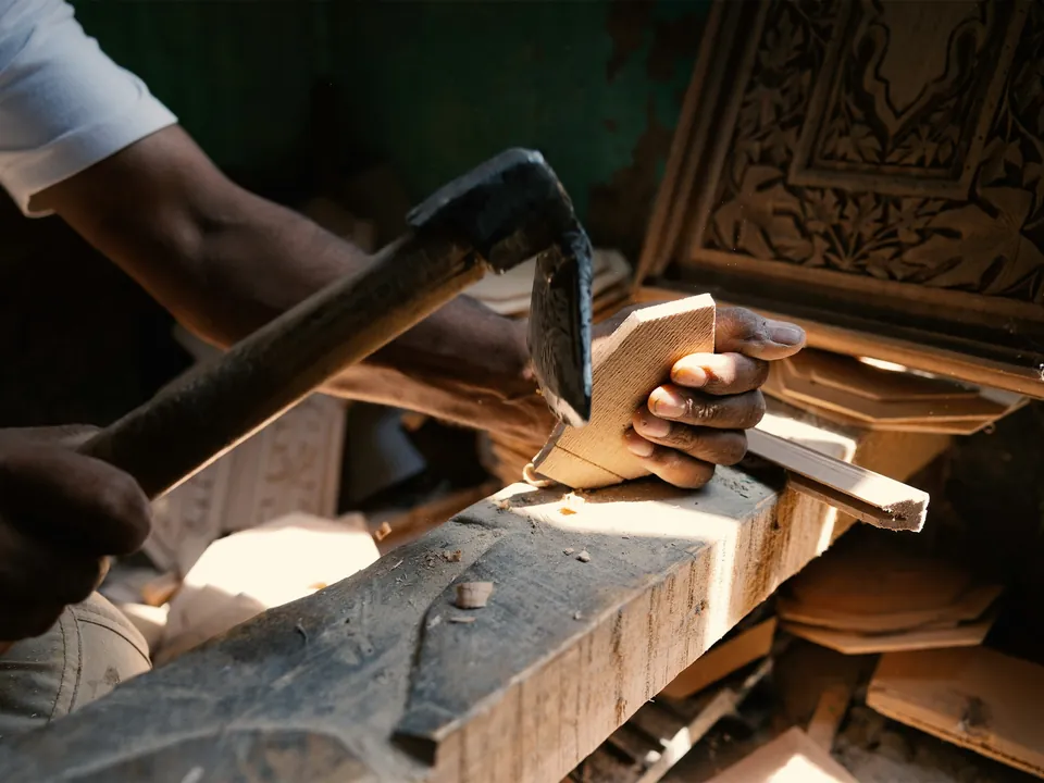 Careful hands working directly with detail